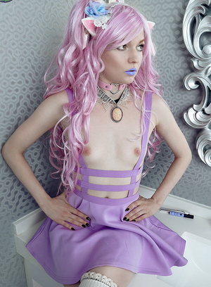 Cosplay teen shows her petite pale body